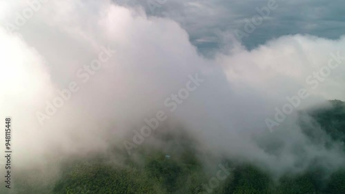 aerial view of mist-covered mountains in Fuyang photo