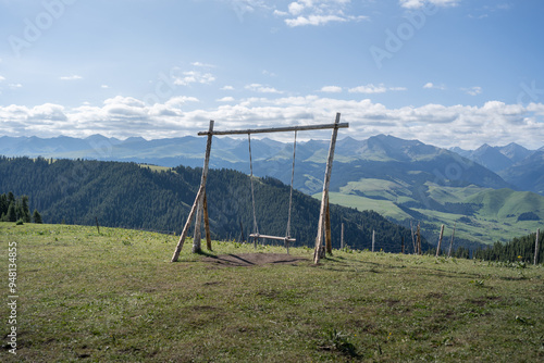 Swing on Karajun Grassland in Xinjiang during Summer photo