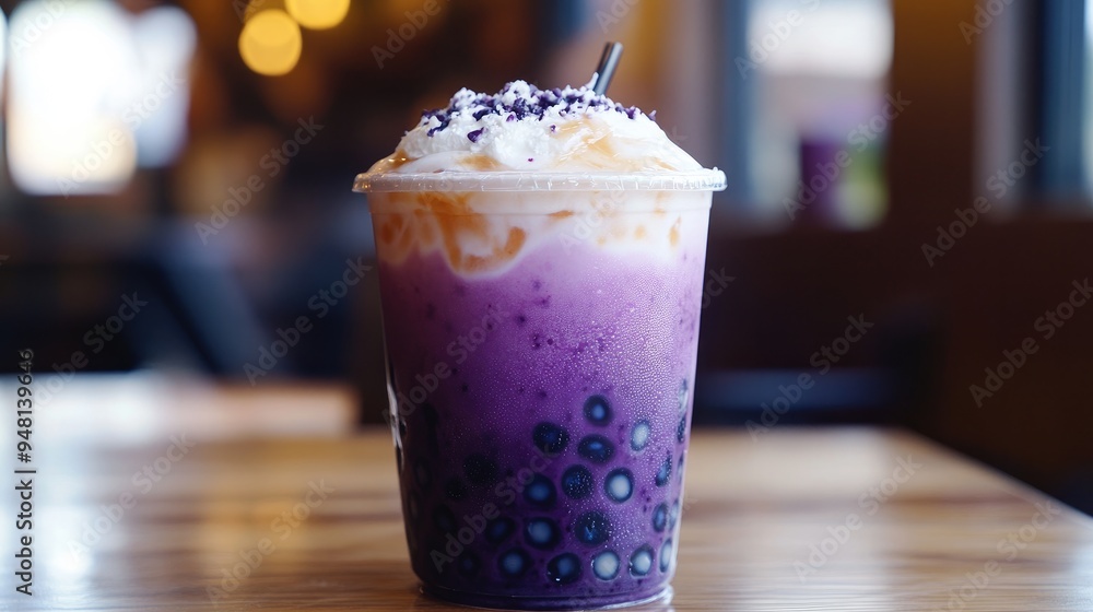 A delicious taro bubble tea with tapioca pearls and a layer of coconut cream on top. A delicious taro bubble tea with tapioca pearls and a layer of coconut cream on top.