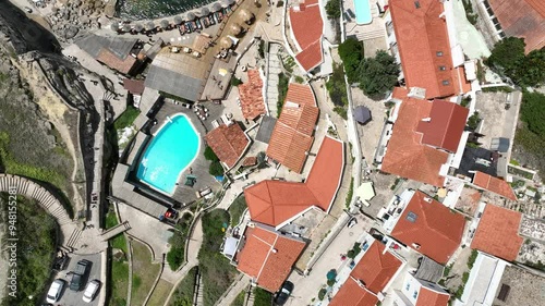 Azenhas do Mar -A bird s eye view of a natural pool on a rocky coastline with turquoise waves crashing on the shore coastallife naturalpool oceanviews aerialphotography