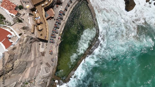 Azenhas do Mar -A bird s eye view of a natural pool on a rocky coastline with turquoise waves crashing on the shore coastallife naturalpool oceanviews aerialphotography