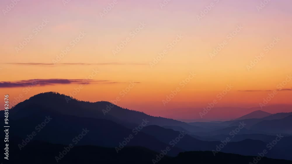 Stunning sunset over mountains with vibrant colors and cloud patterns in the evening sky Stunning sunset over mountains with vibrant colors and cloud patterns in the evening sky