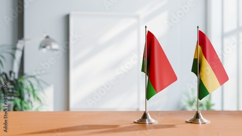 FLAGS OF BELARUS AND BOLIVIA ON TABLE photo