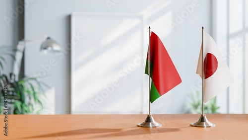 FLAGS OF BELARUS AND JAPAN ON TABLE photo