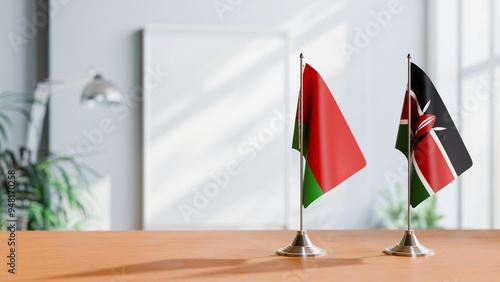 FLAGS OF BELARUS AND KENYA ON TABLE photo