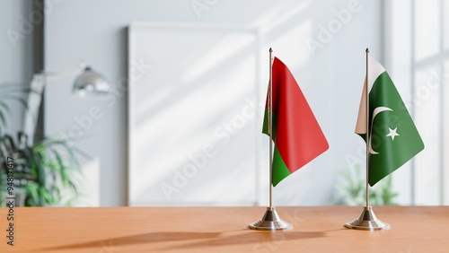 FLAGS OF BELARUS AND PAKISTAN ON TABLE photo