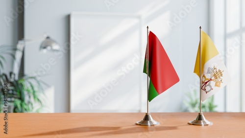 FLAGS OF BELARUS AND VATICAN ON TABLE photo