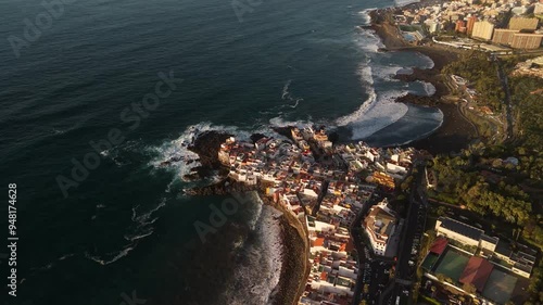 Aerial view of Charcones Punta Brava with beautiful coastal village and sandy beach, Puerto de la Cruz, Spain. photo