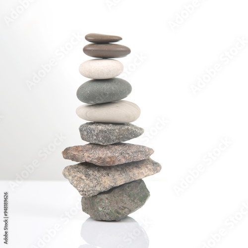Canvas Print pyramid of stacked stones on a white background