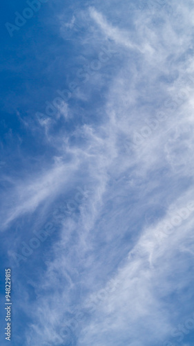 Summer blue sky and fluffy clouds