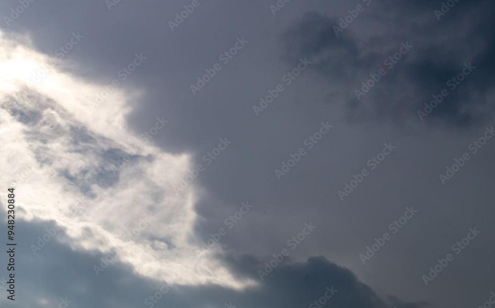 Obraz premium The sky is covered with gray clouds. Gray fluffy rain clouds close-up