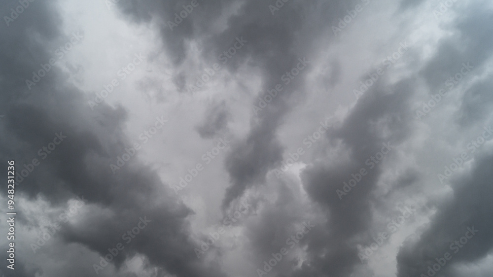 The sky is covered with gray clouds. Gray fluffy rain clouds close-up The sky is covered with gray clouds. Gray fluffy rain clouds close-up