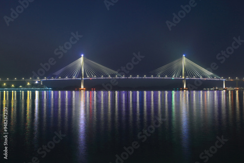 Mokpo-si, Jeollanam-do, South Korea - December 15, 2021: Night view of Mokpo Bridge on the sea with illumination photo