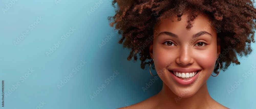 Beautiful woman with natural afro hair, eyes closed and smiling peacefully against a pink backdrop. Beautiful woman with natural afro hair, eyes closed and smiling peacefully against a pink backdrop.