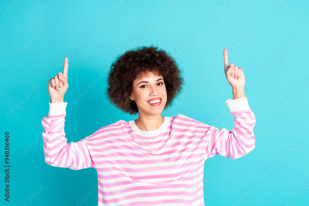 Photo of cheerful pretty lady dressed pink pullover pointing two fingers up empty space isolated teal color background Photo of cheerful pretty lady dressed pink pullover pointing two fingers up empty space isolated teal color background