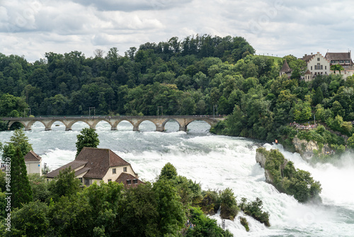 Rhine Falls (Rheinfall) in Switzerland, with castle Schloss Laufen, Neuhausen near the Canton Schaffhausen in Europe photo