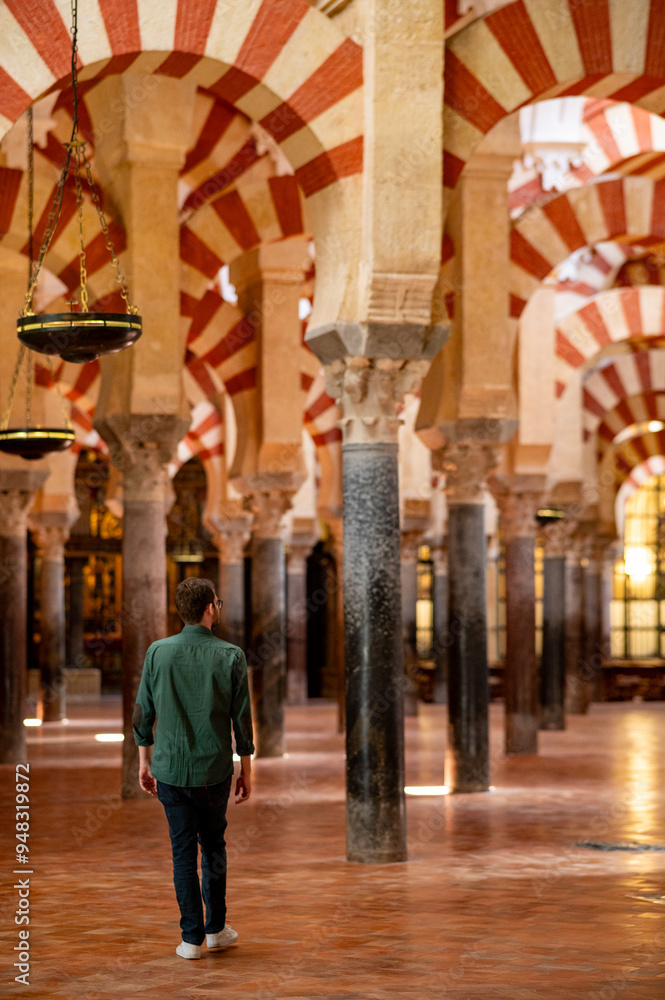 Man in the interior of the cathedral of Cordoba Spain Man in the interior of the cathedral of Cordoba Spain