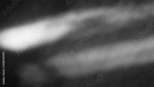 Grunge noise texture with light leaks background 4K stop motion video. Blurred backdrop loop footage with grainy effect. Monochrome black and white overlay video