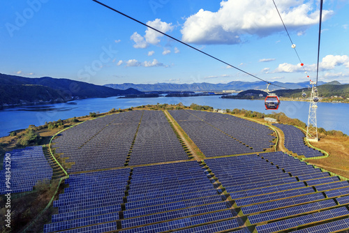 Samaksan Mt, Samcheon-dong, Chuncheon-si, Gangwon-do, South Korea - October 22, 2021: Aerial view of Samaksan Lake Cable Car with the background of solar heat collector at Bungeo Island on Uiamho Lake photo