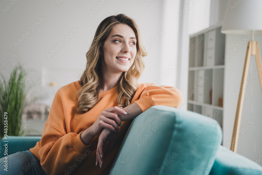 Photo portrait of nice cheerful girl sit sofa look window dreamy dressed orange garment spend pastime spacious house indoors room Photo portrait of nice cheerful girl sit sofa look window dreamy dressed orange garment spend pastime spacious house indoors room