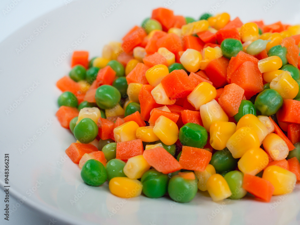 Organic Food. Mixed Vegetables Isolated White Background. Vegetable containing carrots, peas, and corn on white background, Healthy food, Colorful mixed vegetables. Organic Food. Mixed Vegetables Isolated White Background. Vegetable containing carrots, peas, and corn on white background, Healthy food, Colorful mixed vegetables.