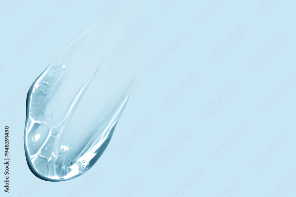 smear of transparent gel on blue background. smear of transparent gel on blue background.