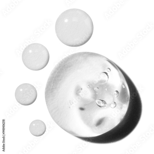 composition of smears of transparent cosmetic gel and drops on an empty background