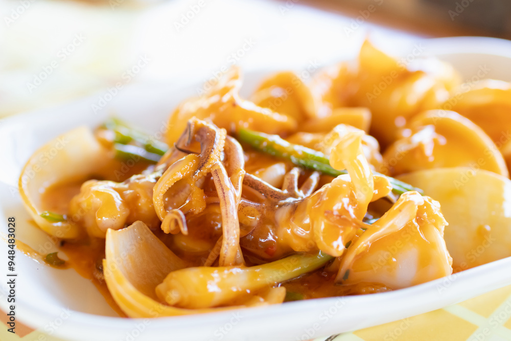 Stir fried squid with salted egg york. Delicious Thai dish. Stir fried squid with salted egg york. Delicious Thai dish.