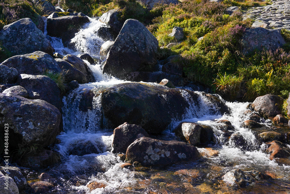 A waterfall in the Cairngorms in Scotland A waterfall in the Cairngorms in Scotland