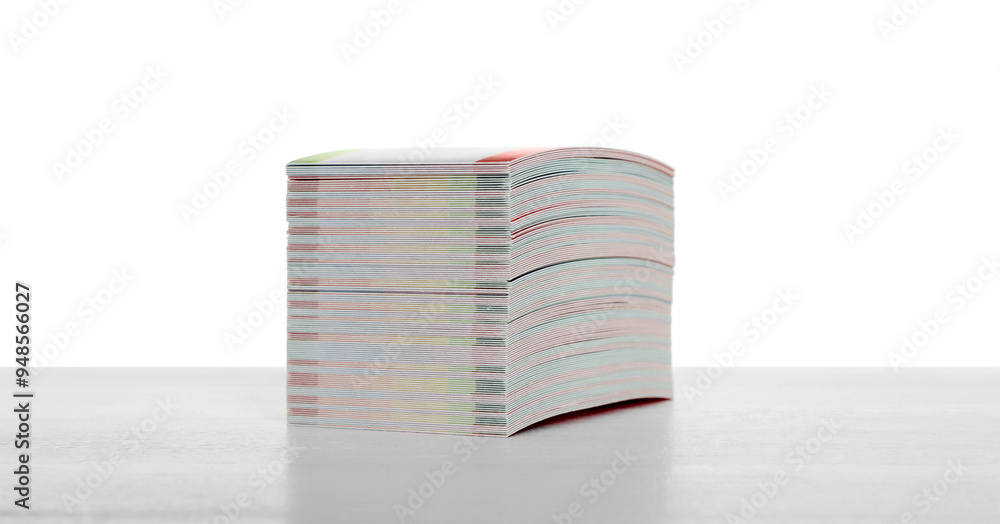 Stack of business cards on table against white background Stack of business cards on table against white background