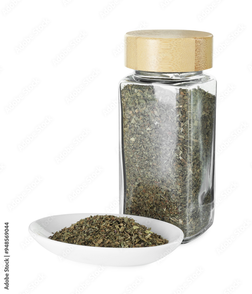 Dry basil in glass jar isolated on white Dry basil in glass jar isolated on white