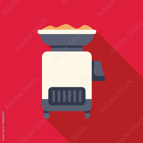 Electric grain grinder crushing wheat for making flour with long shadow