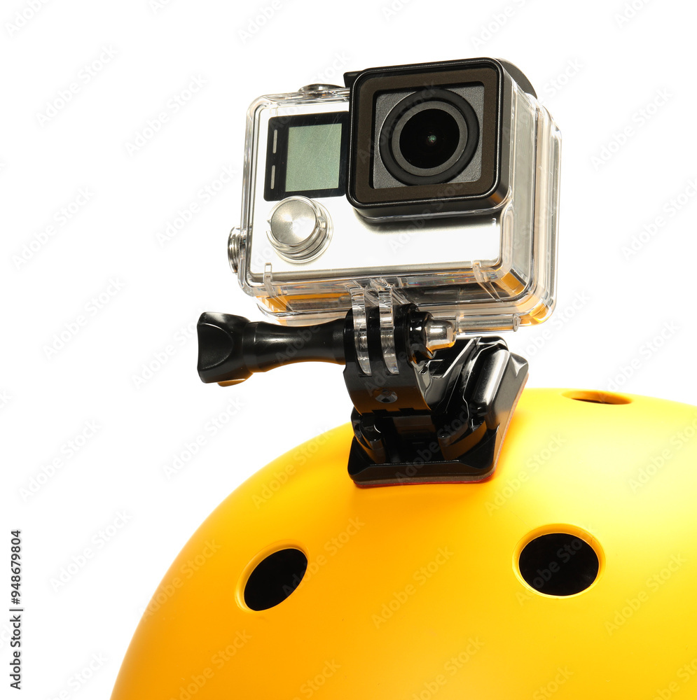 Modern action camera on helmet against white background Modern action camera on helmet against white background