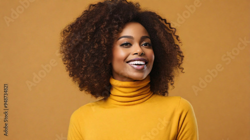 Cheerful Afro American Woman in 30s on colorful background.