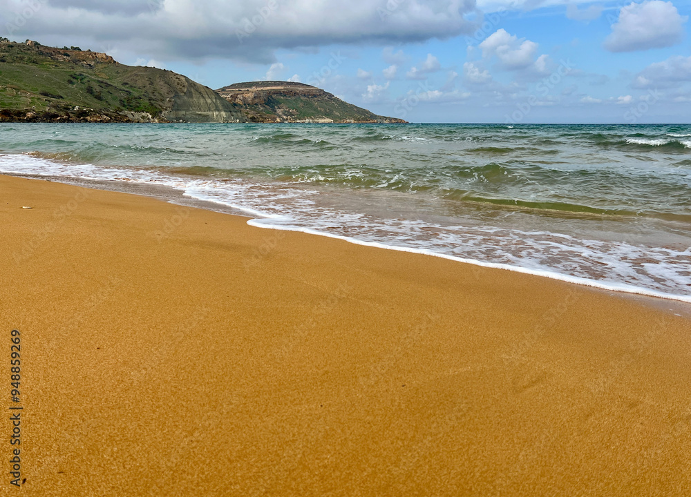 Beautiful sandy beach on the Coast of the island of Gozo, Malta. The Mediterranean Sea. Beautiful sandy beach on the Coast of the island of Gozo, Malta. The Mediterranean Sea.