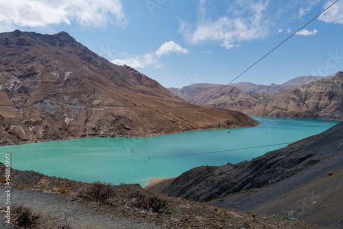 Amazing view of the Manla reservoir (Manak Dam Lake) and its translucent green water in Gyangze County of Shigatse, Tibet Autonomous Region of China photo