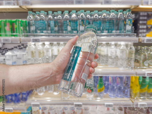 reading information on a bottle of water
