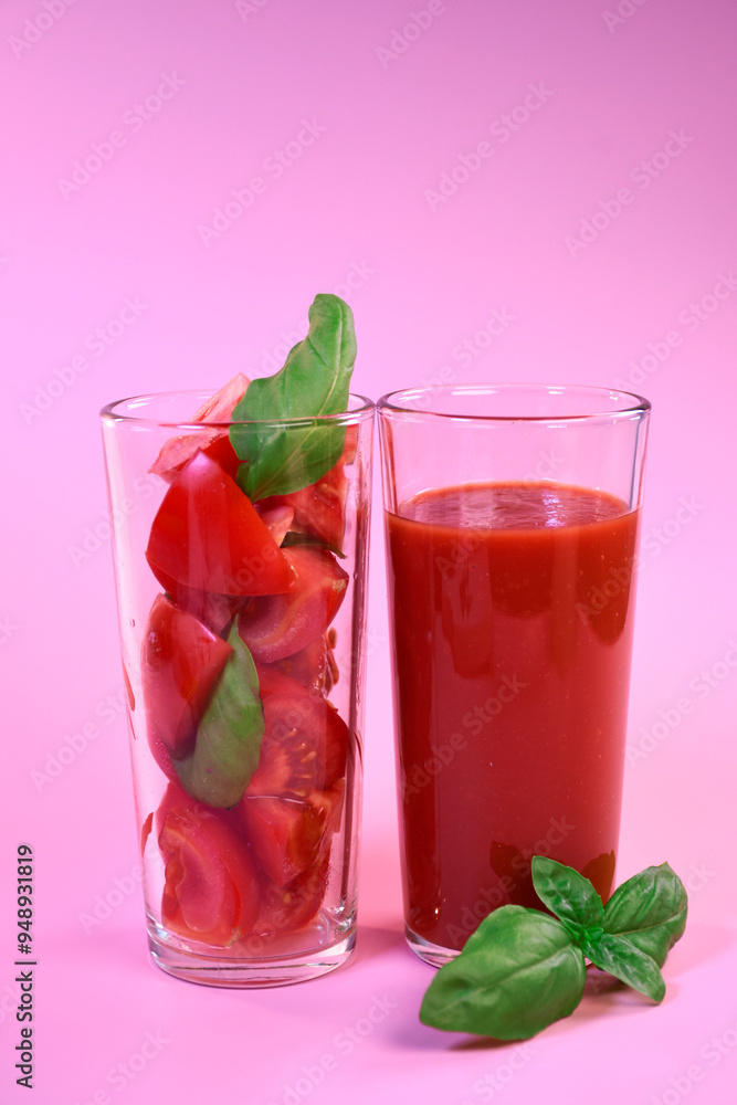 tomato juice in a glass glass and fresh tomatoes in a glass with basil tomato juice in a glass glass and fresh tomatoes in a glass with basil