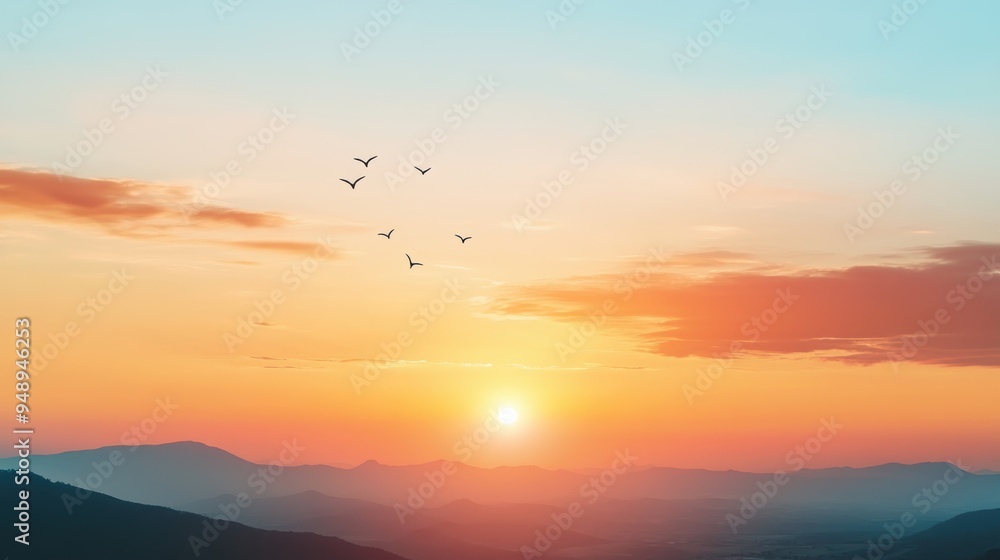 Colorful sunset over mountains with birds flying in the sky Colorful sunset over mountains with birds flying in the sky