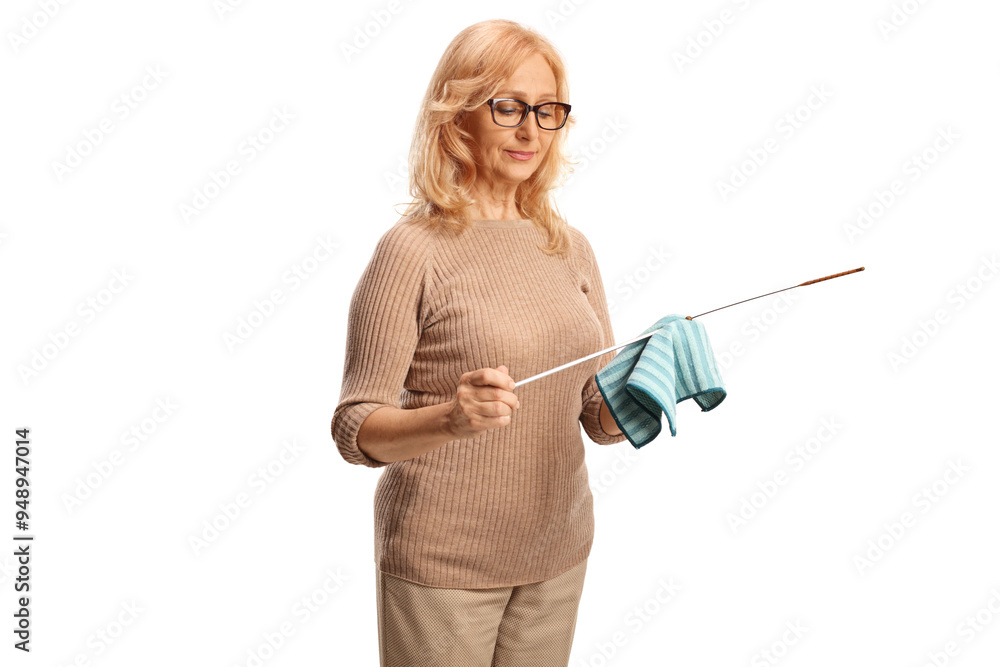 Woman cleaning a dipstick for car engine oil check Woman cleaning a dipstick for car engine oil check