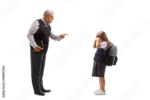 Εκτύπωση καμβά Full length profile shot of a strict teacher scolding a schoolgirl