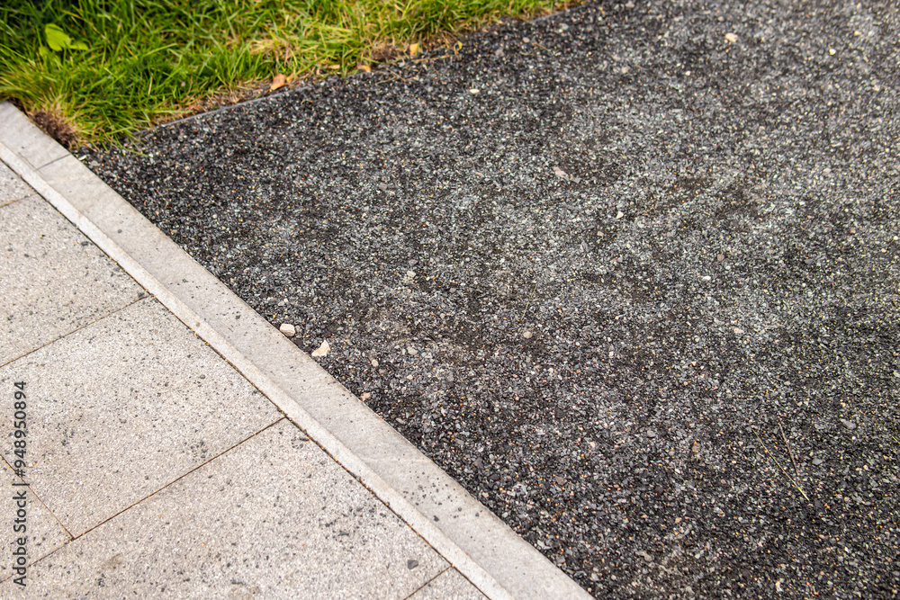 Path made of asphalt crumbs. Path in the park or garden Path made of asphalt crumbs. Path in the park or garden