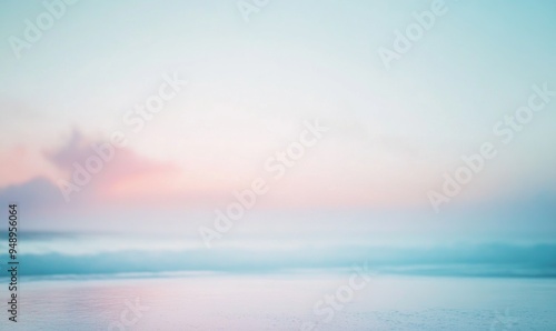 A blurry image of a beach with a cloudy sky in the background