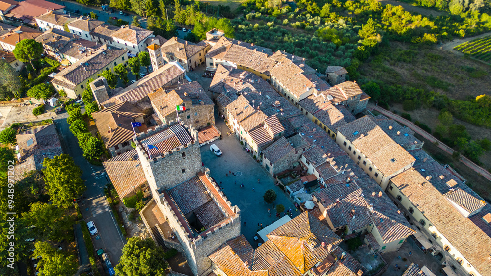 An aerial view of Castellina in Chianti, a picturesque town in Tuscany's renowned Chianti wine region, captured by a drone. Perched on a hill, Castellina in Chianti is surrounded by rolling vineyards An aerial view of Castellina in Chianti, a picturesque town in Tuscany's renowned Chianti wine region, captured by a drone. Perched on a hill, Castellina in Chianti is surrounded by rolling vineyards