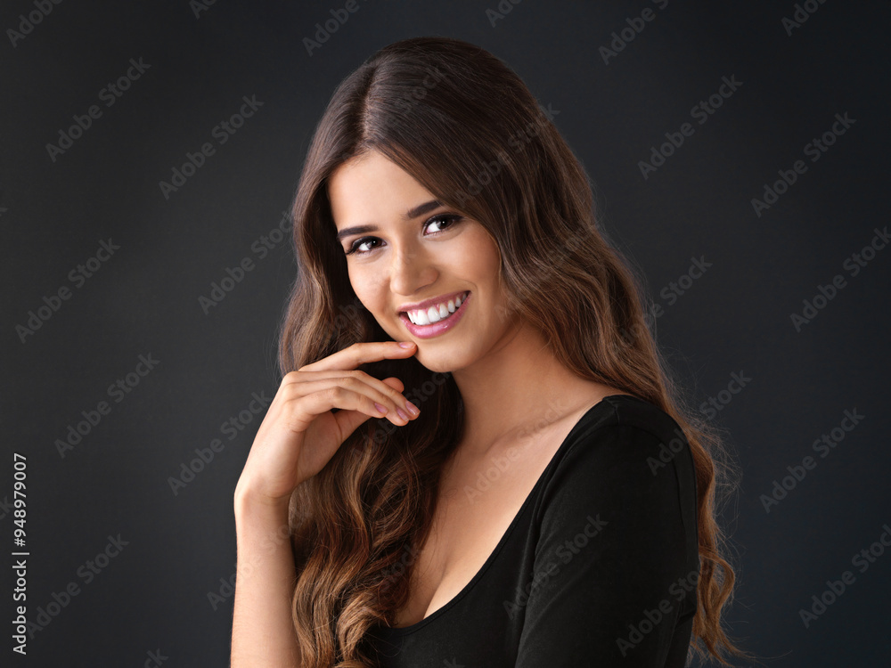 Portrait, smile and haircare for woman in studio, proud and texture of hair and treatment in salon. Black background, shine and strong hairstyle with cosmetics of model, person and hairdo in space Portrait, smile and haircare for woman in studio, proud and texture of hair and treatment in salon. Black background, shine and strong hairstyle with cosmetics of model, person and hairdo in space