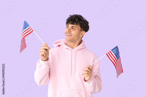 Young man with USA flags on...