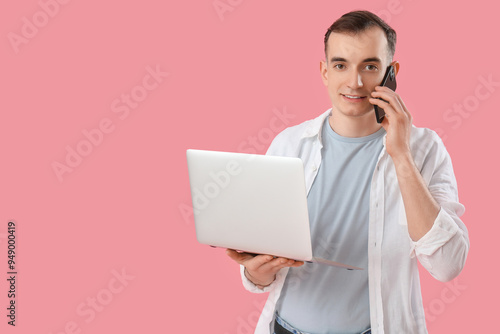 Young man with laptop talki...