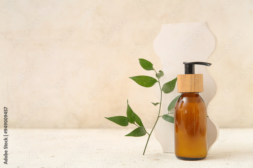 Bottle of cosmetic product, plaster decor and plant branch on light background Bottle of cosmetic product, plaster decor and plant branch on light background