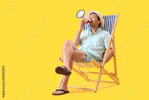 Young man with megaphone sh...