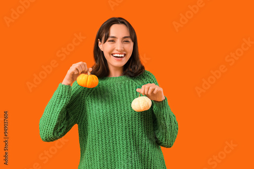 Young woman with pumpkins o...